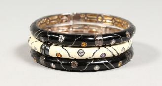 THREE SILVER AND ENAMEL BRACELETS