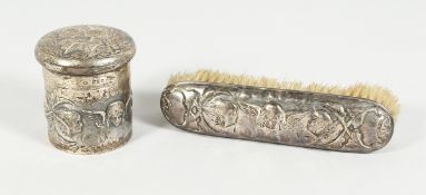 A VIICTORIAN SILVER CHERUB CIRCULAR PIN BOX AND COVER and a brush (2). London 1898