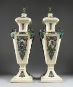 A SUPERB PAIR OF VIENNA IVORY TAPERING VASES AND COVERS, mounted silver and enamel plaques set