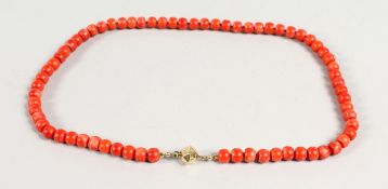 A CORAL NECKLACE with gold clasp