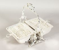 A SILVER PLATED BISCUIT AND CHEESE STAND on a rustic stand