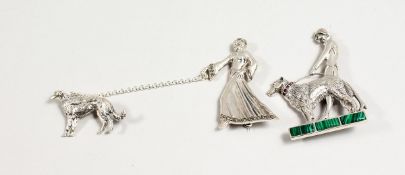 TWO SILVER BROOCHES, ART DECO DESIGN, ladies with dogs.