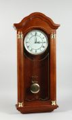 A WESTMINSTER CHIME, LONDON CLOCK CO. HANGING CLOCK, 2 ft. 3 in. high.