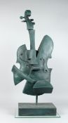 AN ABSTRACT BRONZE CELLO on an rectangular base 34 ins high.