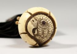 A VICTORIAN UMBRELLA with carved ivory parrot handle