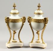 A VERY GOOD PAIR OF LOUIS XVI STYLE WHITE MARBLE AND ORMOLU CASSOLETTES with rams masks on hoof