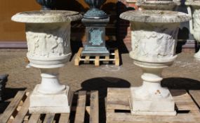 A SUPERB NEAR PAIR OF ITALIAN CARVED WHITE MARBLE URNS ON STANDS, the sides covered with dancing