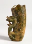 A STIRRUP CUP CARVED WITH A PHOENIX HANDLE, 5 ins high