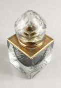A VERY HEAVY CUT GLASS AND BRASS TABLE INKSTAND with hinged top. 3.75ins square.