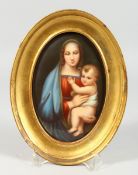A GOOD OVAL PORCELAIN PLAQUE Madonna and child 6 x 4 ins in a gilt frame.