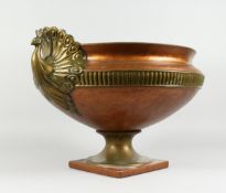 A COMPOSITION GILT CIRCULAR JARDINIERE with swan handles, 16 ins diameter