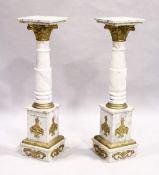 A GOOD PAIR OF WHITE VEINED MARBLE TORCHERES with squared tops, gilt Corinthian capitals and