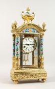 A CLOISONNE REGULATOR CARRIAGE CLOCK 21 ins high with column supports and urn finials.