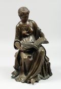 A CLASSICAL BRONZE SEATED FIGURE reading a book, 10 ins high.
