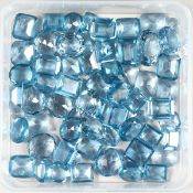 A BOX OF AQUAMARINE STONES