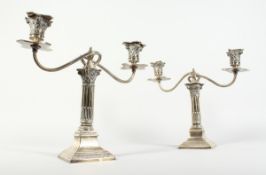 A PAIR OF CORINTHIAN COLUMN TWO BRANCH CANDLESTICKS on a square base 11.5ins high