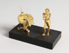 A GILT BRONZE GROUP OF NAPOLEAN AND DRUM TABLE on a marble base 4.5 ins long