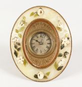 AN ONYX OVAL STRUTT TYPE CLOCK by BIRCH & CAYDEN, Fenchurch Street. 8.5 ins x 6.5 ins