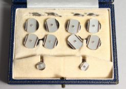 A BOXED SET OF 9ct WHITE GOLD & MOTHER OF PEARL DIAMOND SET CUFF LINKS AND STUDS
