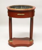 A FRENCH EMPIRE PAINTED AND ORMOLU MOUNTED OVAL JARDINIERE, with a lead trough, pair of column