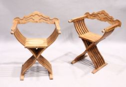 A PAIR OF FOLDING CROSS FRAME SEAT.