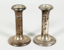 A PAIR OF SILVER DWARF CANDLESTICKS, 4.5 inches high with loaded bases, Birmingham 1905.