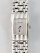 A GOOD BOUCHERON WRISTWATCH in a white leather pouch, No. AK416582.