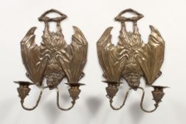 A PAIR OF BRONZE BAT WALL SCONCES each with two scrolling arms 12 ins