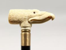 A CARVED BONE EAGLE HANDLE WALKING STICK