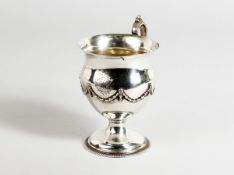 A CLASSICAL SILVER PEDESTAL MUG with garlands London, 1910.