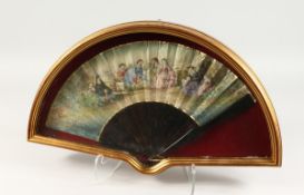 A GOOD 18TH CENTURY FRENCH TORTOISESHELL AND PAPER FAN in a glass case, ladies and children in a