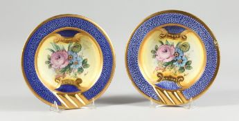 A PAIR OF ITALIAN CIRCULAR PORCELAIN ASHTRAYS, painted with roses, 8in. diameter