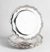 A SET OF EIGHT ODIOT OF PARIS CAST SILVER DINNER PLATES No. 3613, pies crust with beaded edge, 10