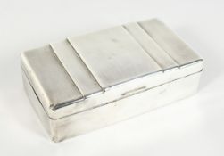 AN ENGINE TURNED & PLAIN SILVER CIGARETTE BOX with cedar wood liner, 6.25 inches long, London 1935.