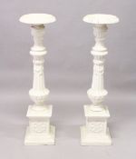 A GOOD PAIR OF VICTORIAN WHITE PAINTED CAST IRON STANDS, fluted columns on pedestal bases. 3ft