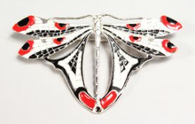 A SILVER ART DECO DESIGN RED, BLACK AND WHITE ENAMEL DRAGONFLY BROOCH