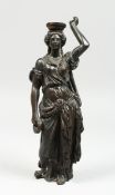 AFTER THE ANTIQUE A BRONZE OF A CLASSICAL FIGURE, arm raised, 10 ins high.