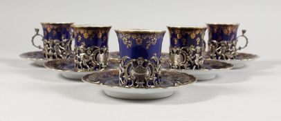 A SET OF FIVE ROYAL VIENNA BLUE AND GILT CUPS AND SIX SAUCERS with silver handles
