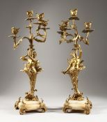 A GOOD PAIR OF 19TH CENTURY FRENCH SEMI NUDE LADIES holding four candle branches on an onyx base