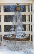 A LARGE ORMULU AND CUT GLASS BAG STYLE CHANDELIER 3 ft 6 ins high x 2 ft wide