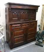 AN 18TH CENTURY OAK DUODARN, the upper section with two arched panelled doors flanking a pair of