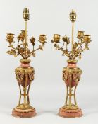 A VERY GOOD PAIR OF REGENCY, ORMOLU AND MARBLE URN SHAPED THREE BRANCH CANDELABRA, mounted with