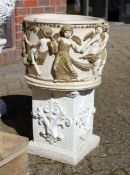A CIRCULAR GARDEN POT, the sides with classical figures 1 ft diameter
