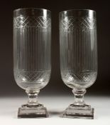 A GOOD PAIR OF ENGRAVED STORM LAMPS on square bases 15 ins high