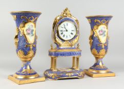 AN ITALIAN THREE PIECE CLOCK GARNITURE comprising blue and gilded clock, painted with flowers, 19