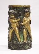 A GOOD TWO COLOUR BRONZE CIRCULAR STAND with Bacchanalian cherubs, square marble top, 2 ft. 6 in.