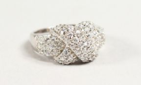 A SILVER AND CZ CROSSOVER RING