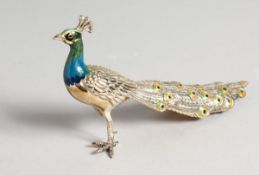 A SILVER AND ENAMEL PEACOCK. 15.5cm long. (AF)
