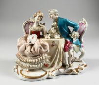 A CONTINENTAL PORCELAIN GROUP GALLANT AND LADY, 8 ins. high.