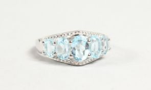 A SILVER FIVE STONE AQUAMARINE RING